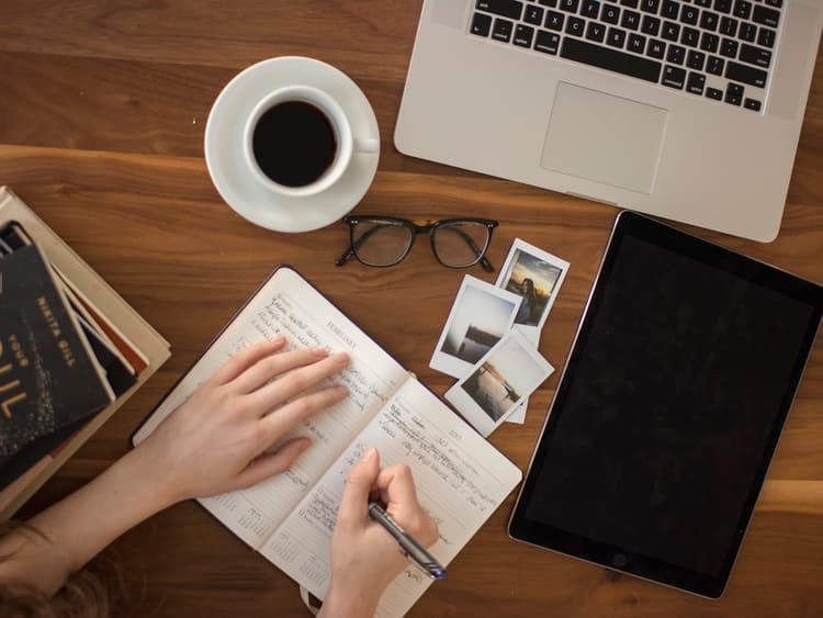 An overhead view of a study desk with a notebook